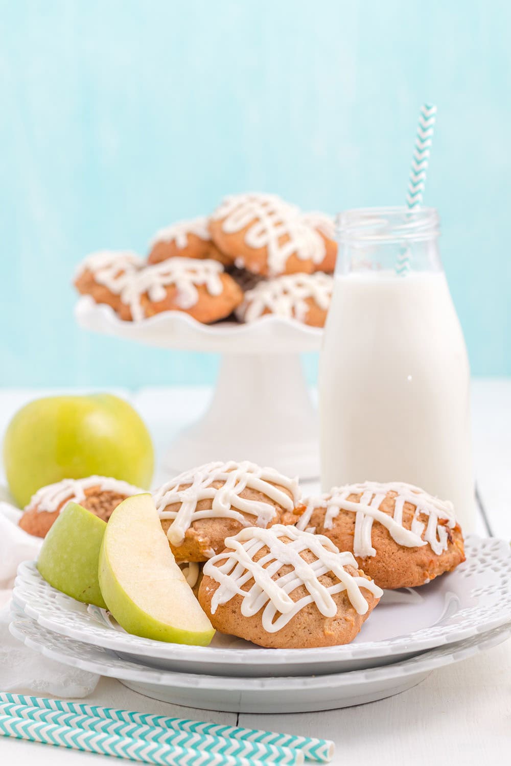 Cookies on a plate and then on a tray in the back.
