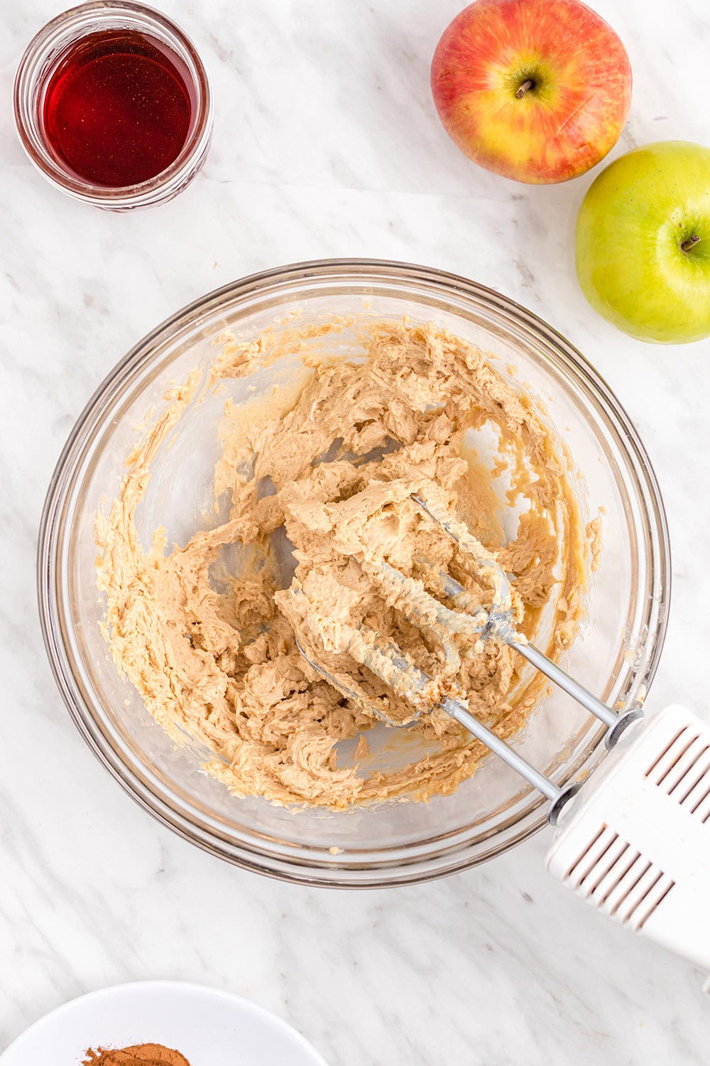Cookie dough batter in a bowl with mixers.