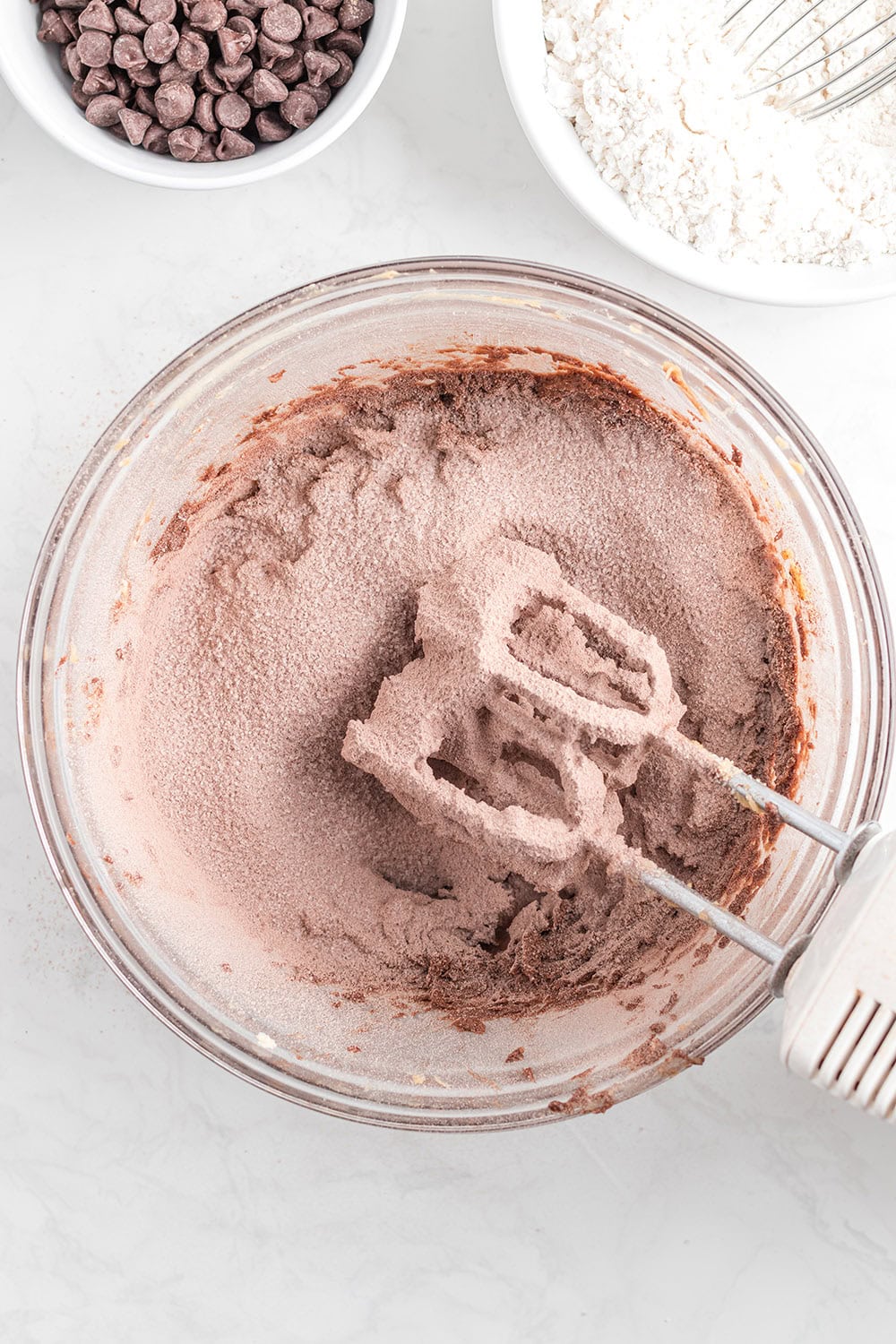 Flour mixture in batter with a mixer.
