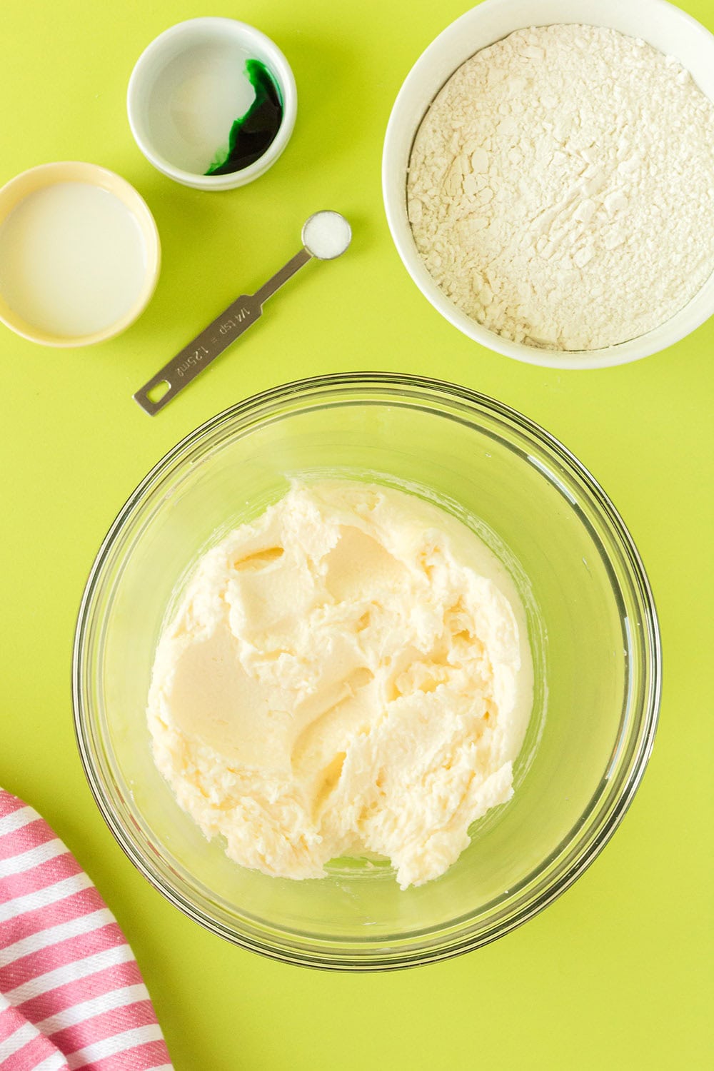 Butter and sugar creamed together in a mixing bowl.
