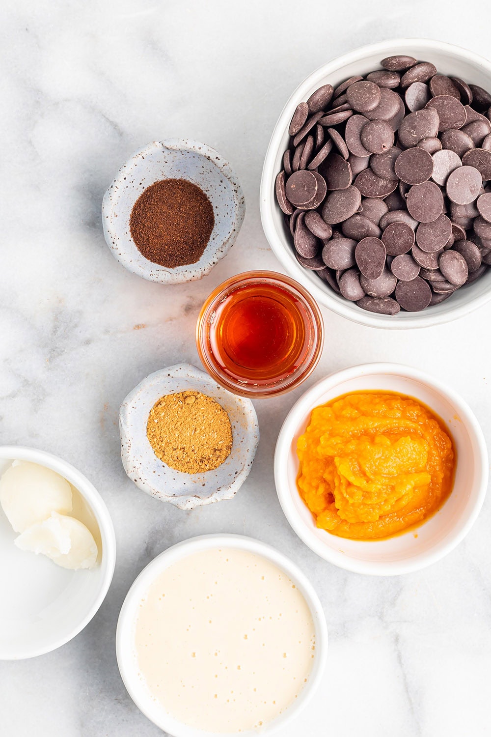 Pumpkin, chips, and other ingredients to make pumpkin candy cups.