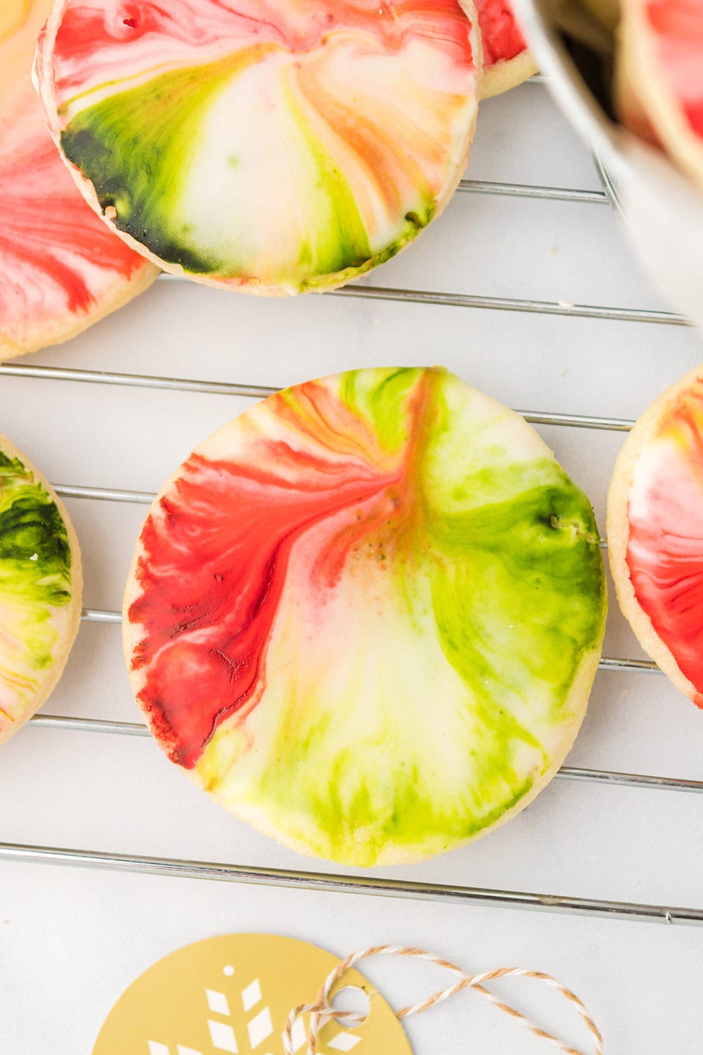 Red and green swirled cookies on a table. 