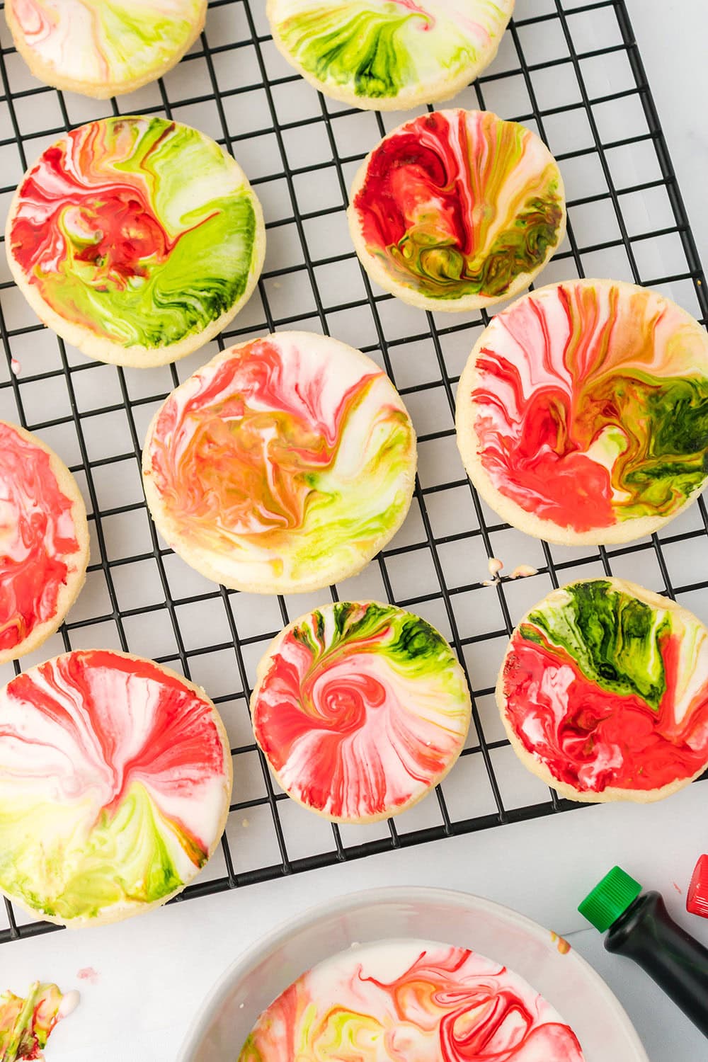 Iced sugar cookies on a cooling rack. 