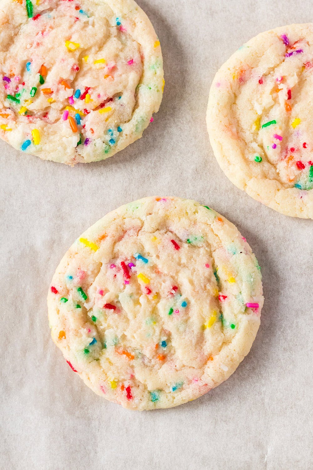 Closeup of Funfetti cookies on a baking sheet.