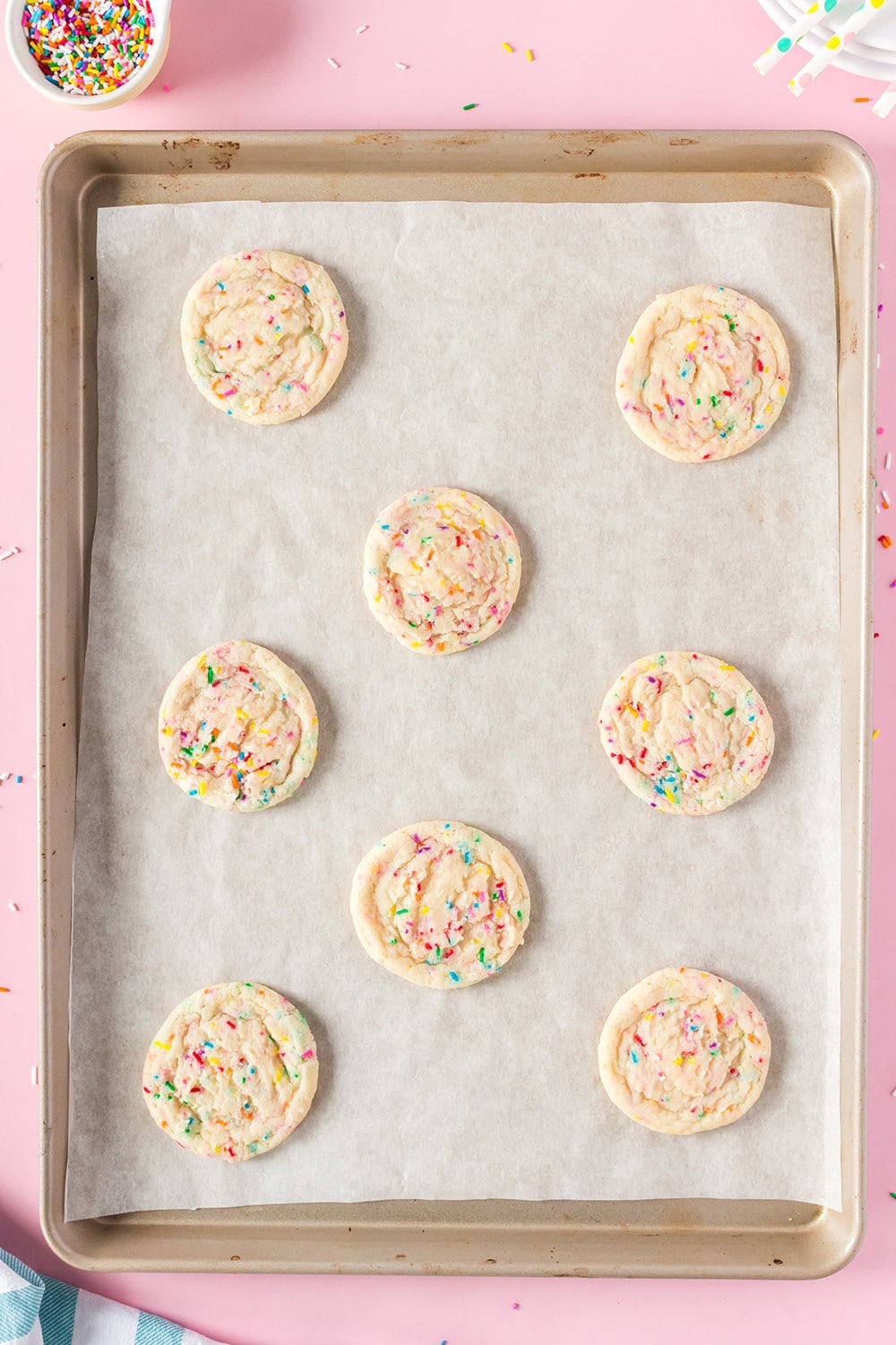 Baked confetti cookies on a baking sheet.
