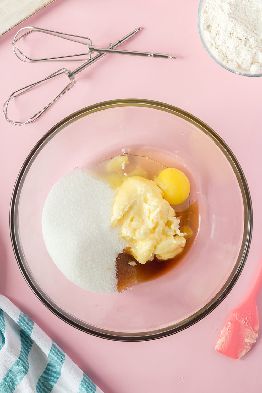Eggs, flour, butter, and vanilla in a mixing bowl.