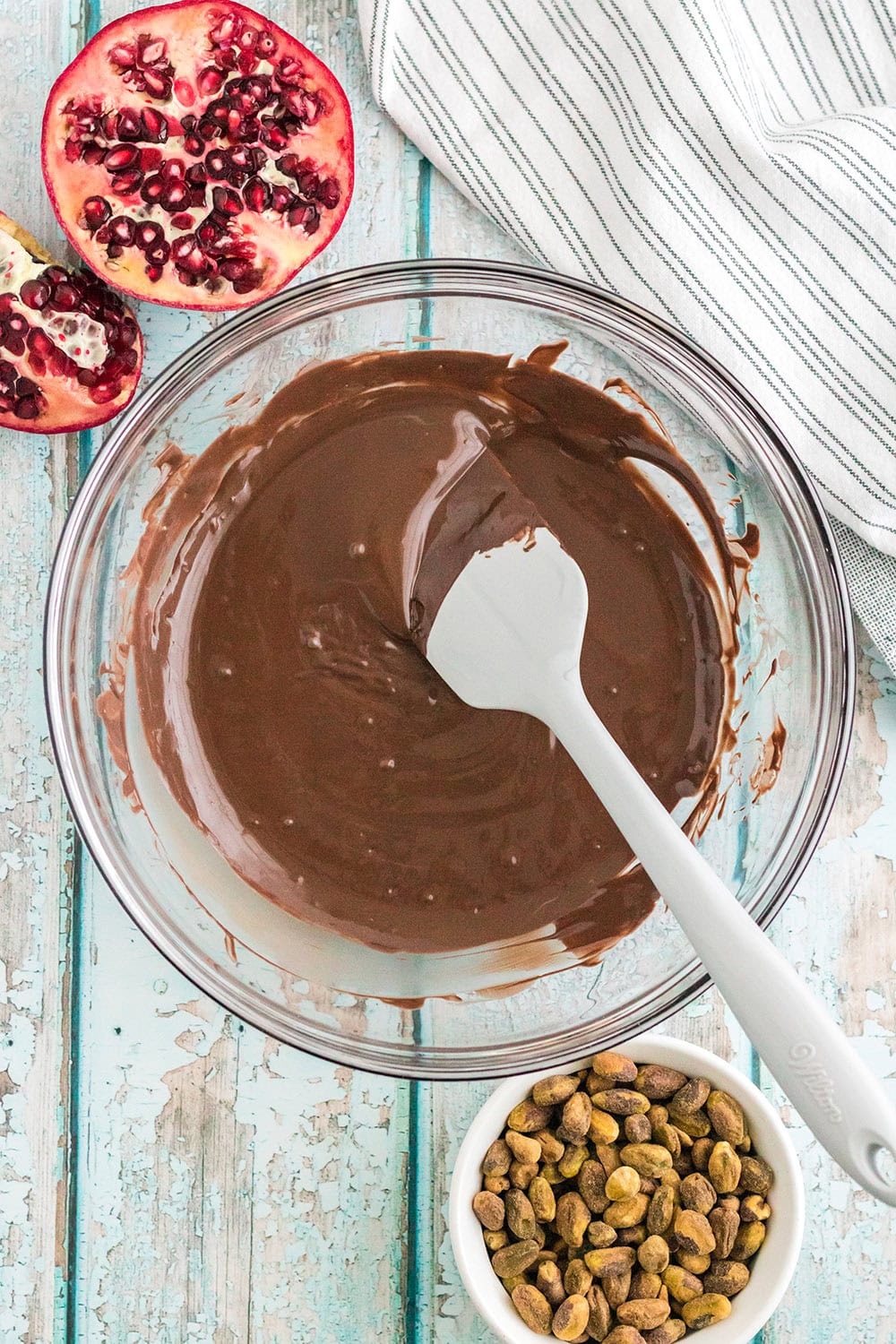 Stirring melted chocolate in a bowl.