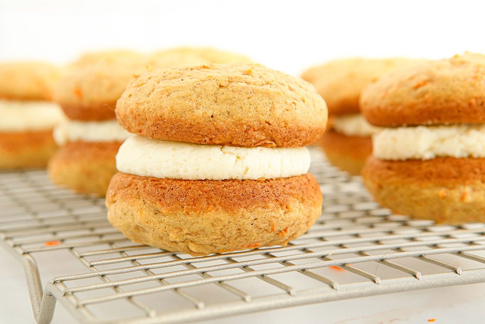 Carrot whoopie pies on a rack. 