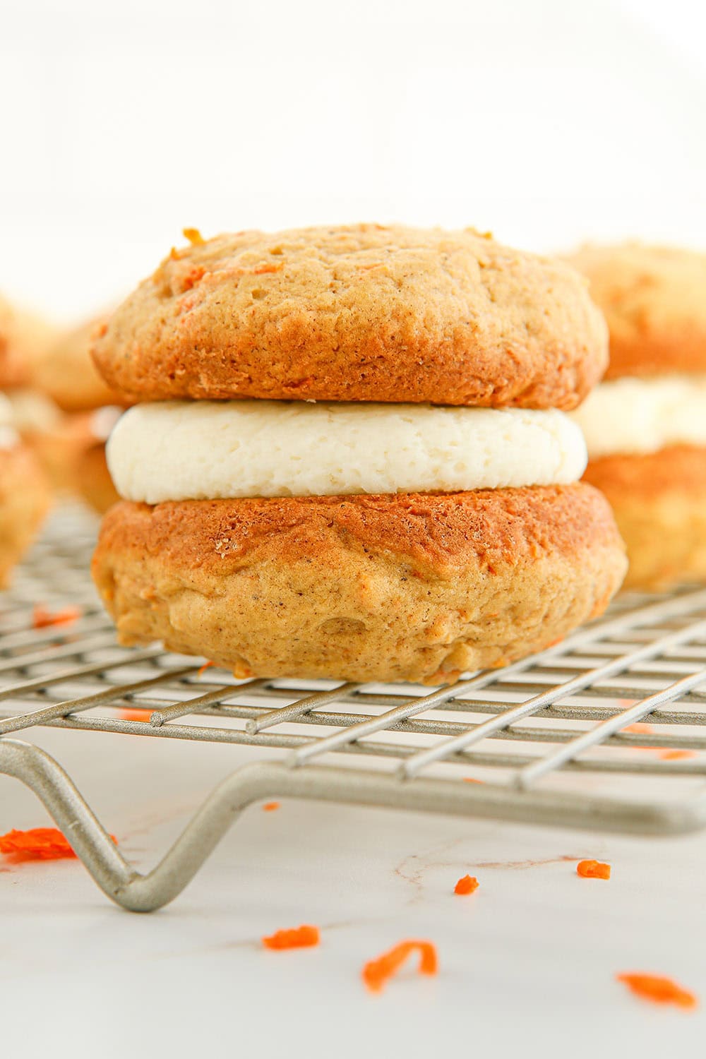 Carrot whoopie pie on a rack. 