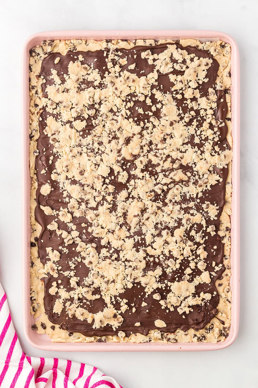 A tray of cookie dough bark before it's cracked.