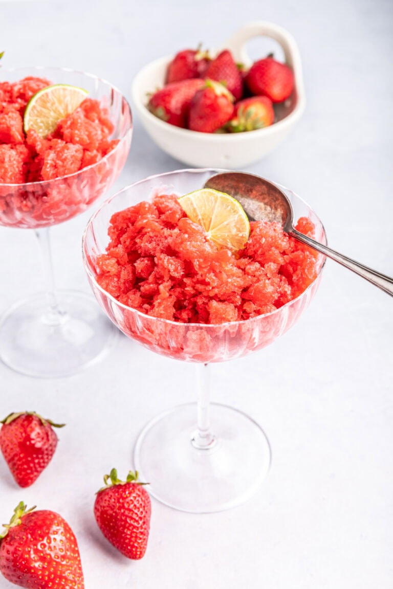 Strawberry lime granita in a wine glass.