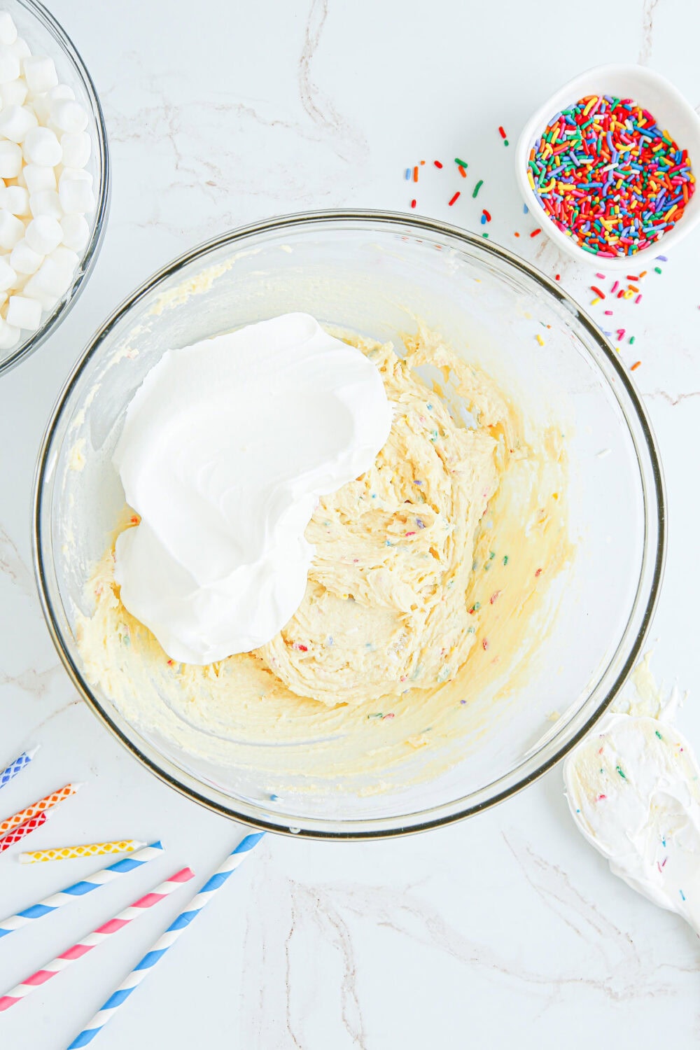Whipped topping in pudding mixture in a bowl. 