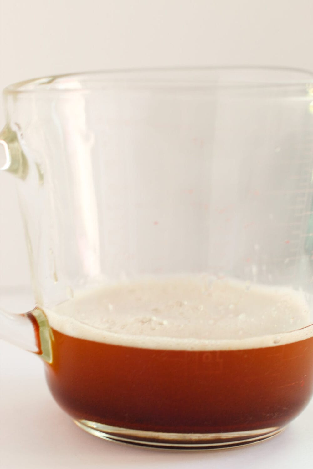 Browned butter in a glass.