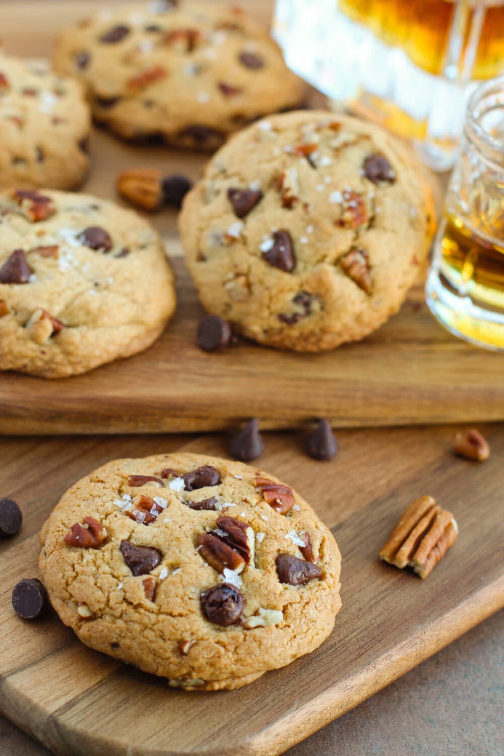 Bourbon chocolate chip pecan cookies on boards.