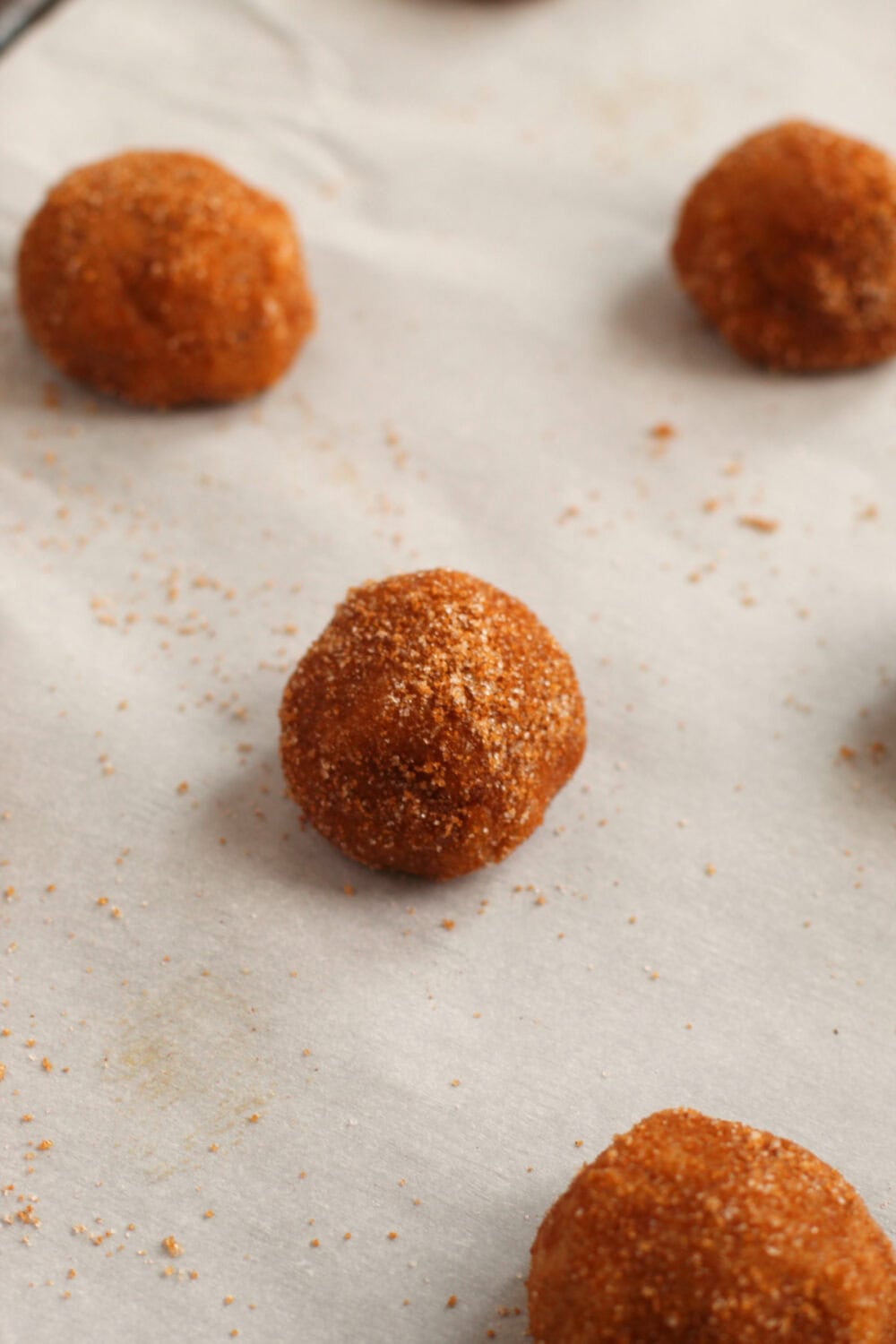Round cookie dough on a sheet. 