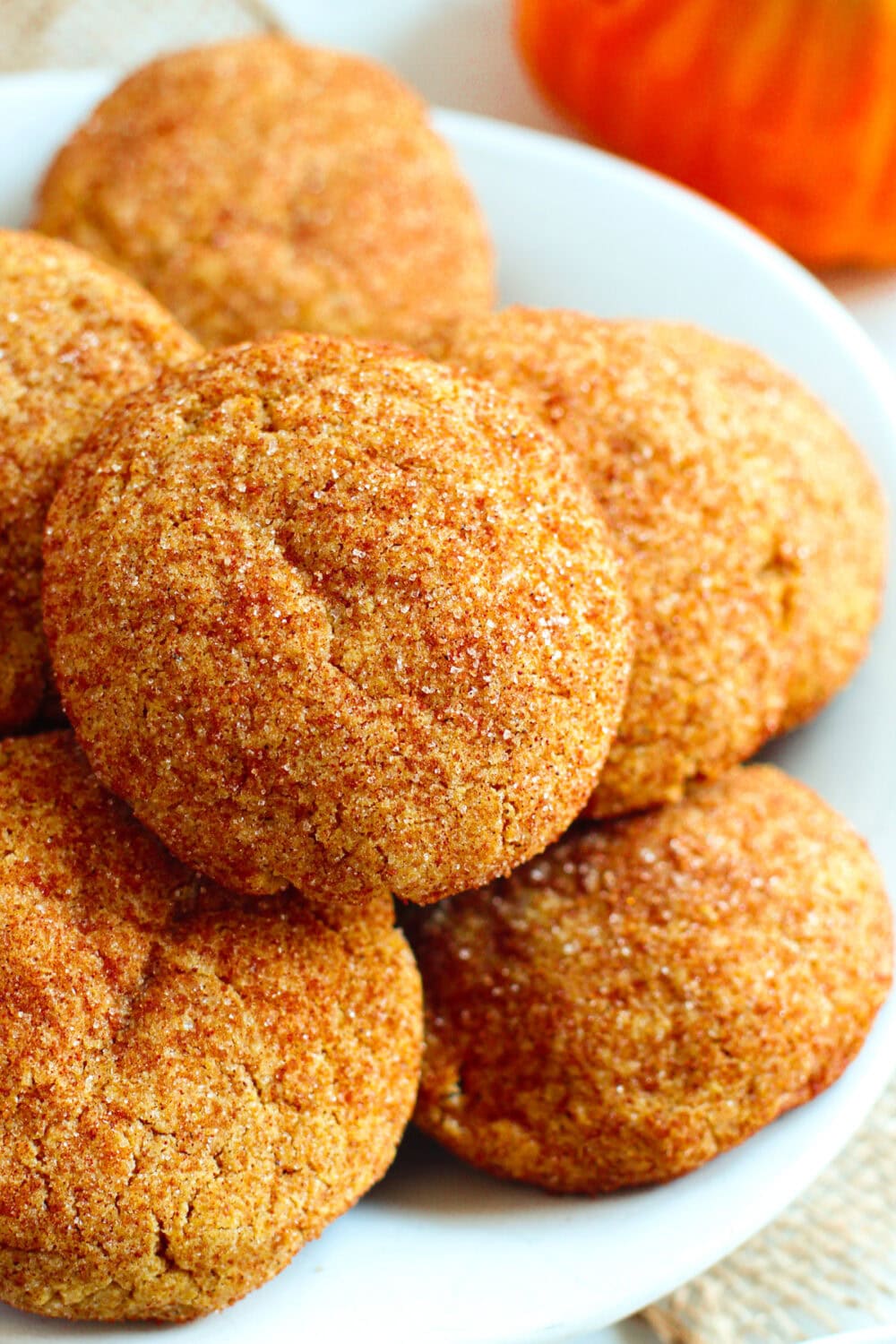 Browned butter pumpkin cookies on top of each other in a dish. 