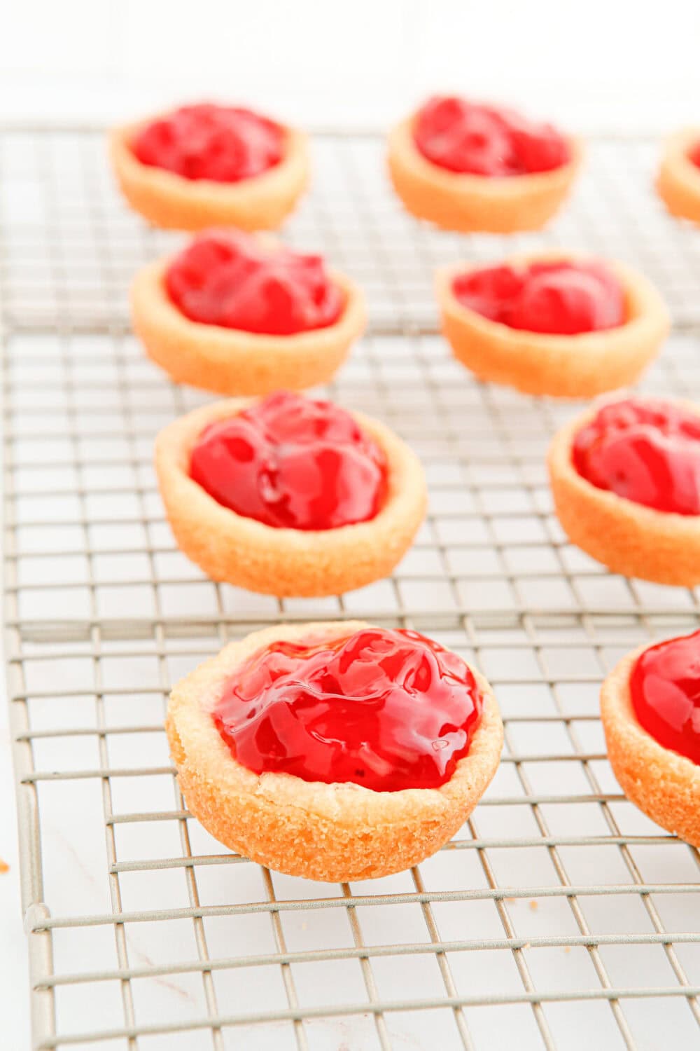 Cherry pie filling in sugar cookie crusts. 