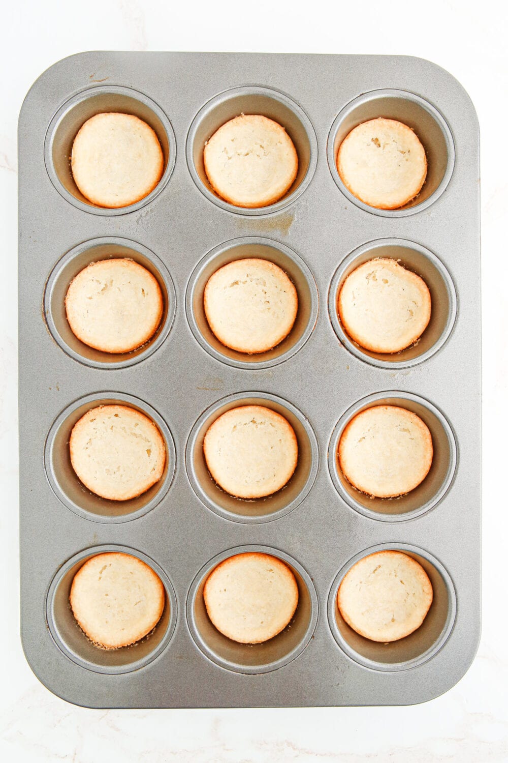 Baked sugar cookie crusts in muffin tins. 