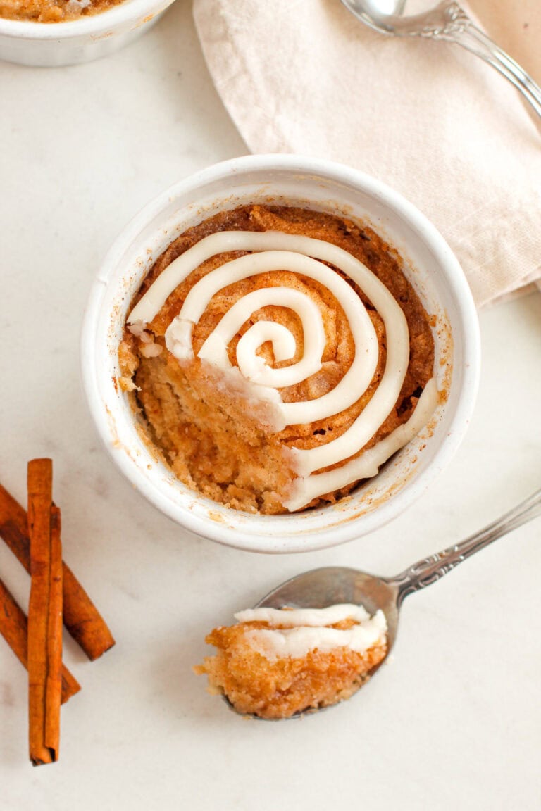 Cake with a spoonful taking out with the spoon next to it.