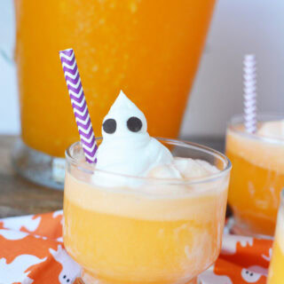 Orange spooky punch with ghosts toppings.