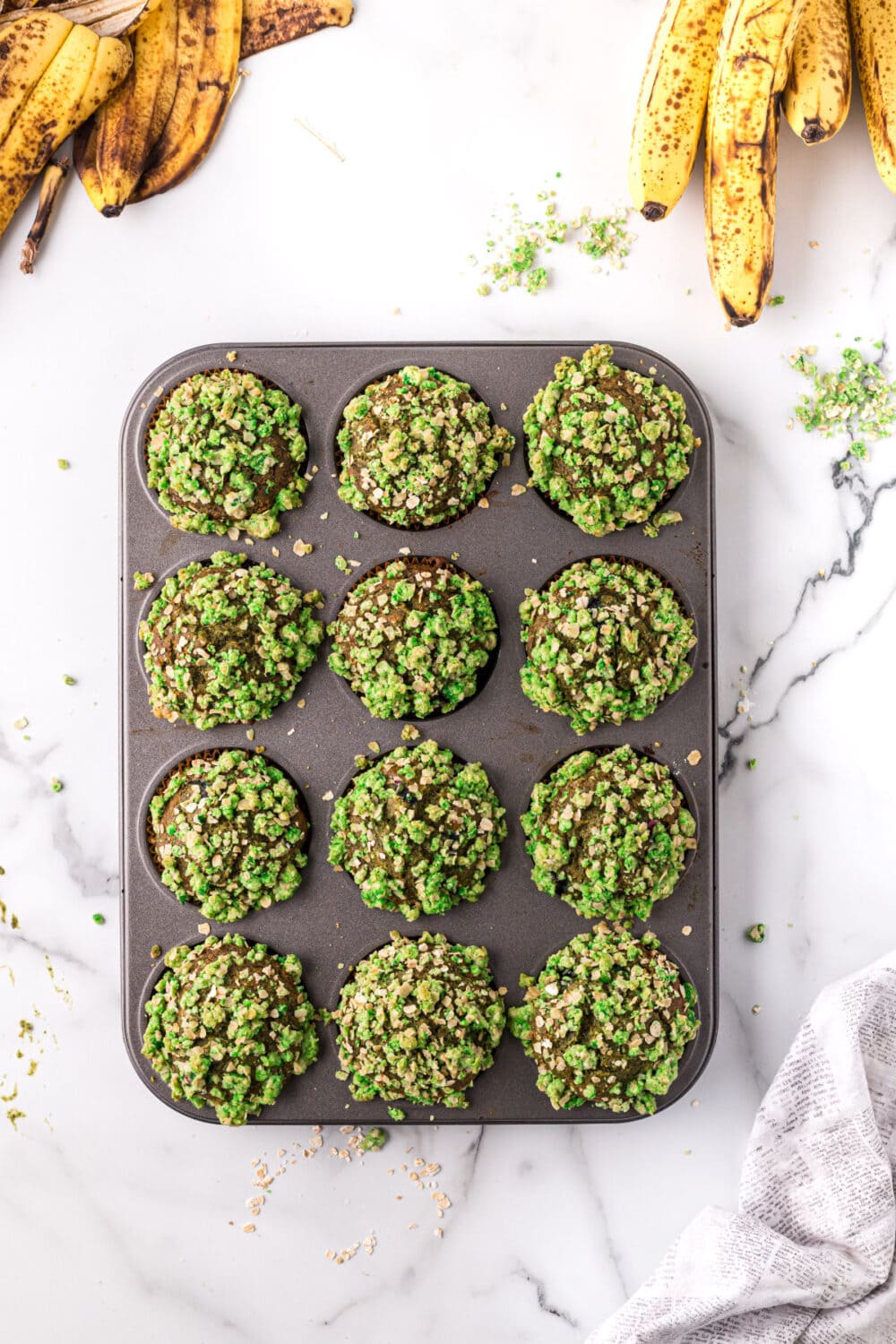 Baked spinach banana muffins in the tin.
