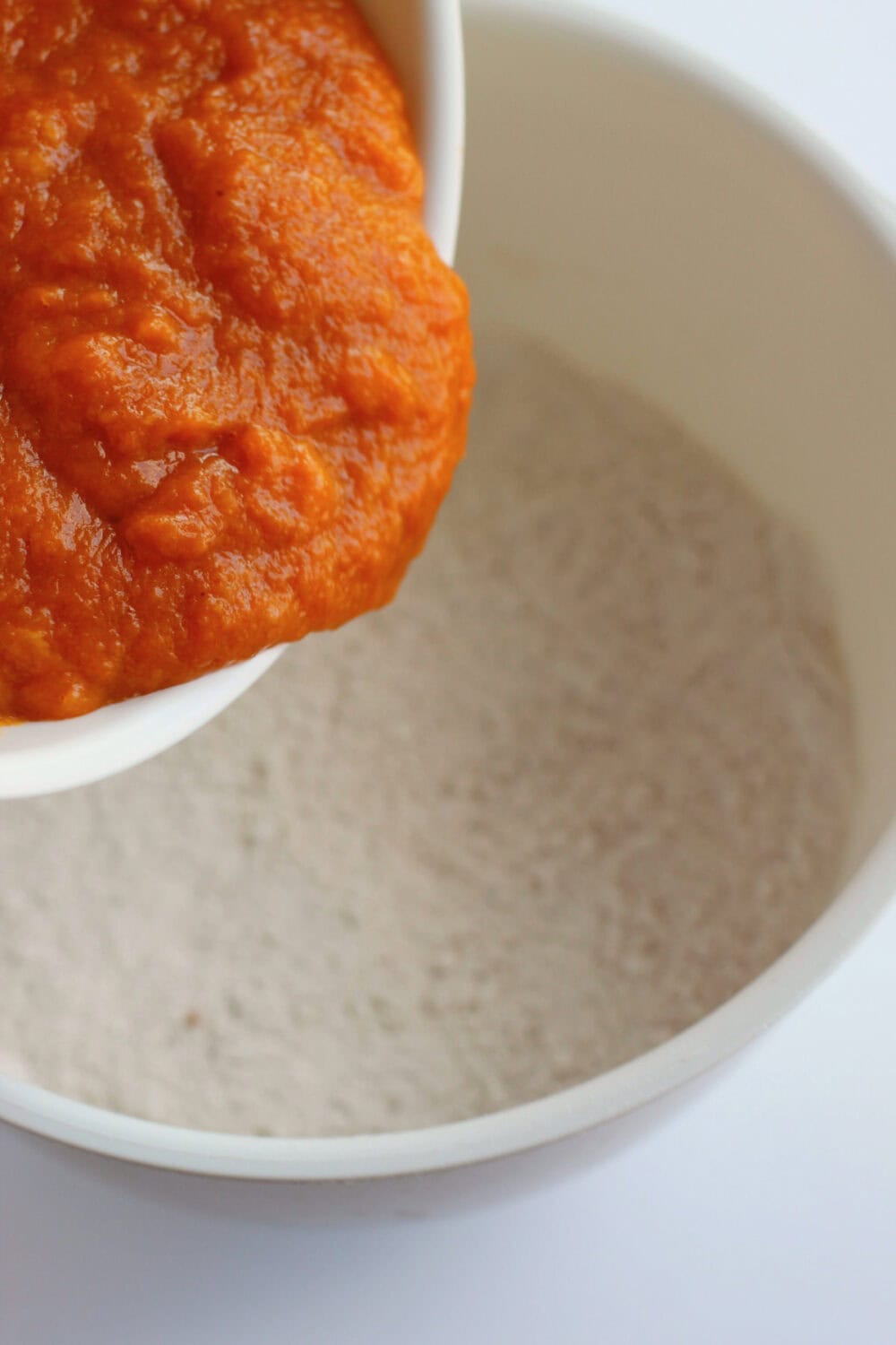 Adding pumpkin mixture to dry ingredients. 