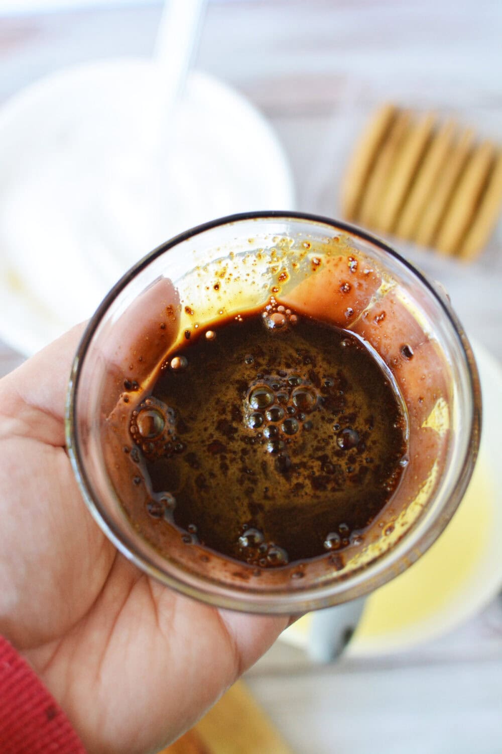 Instant coffee and water in a small bowl. 