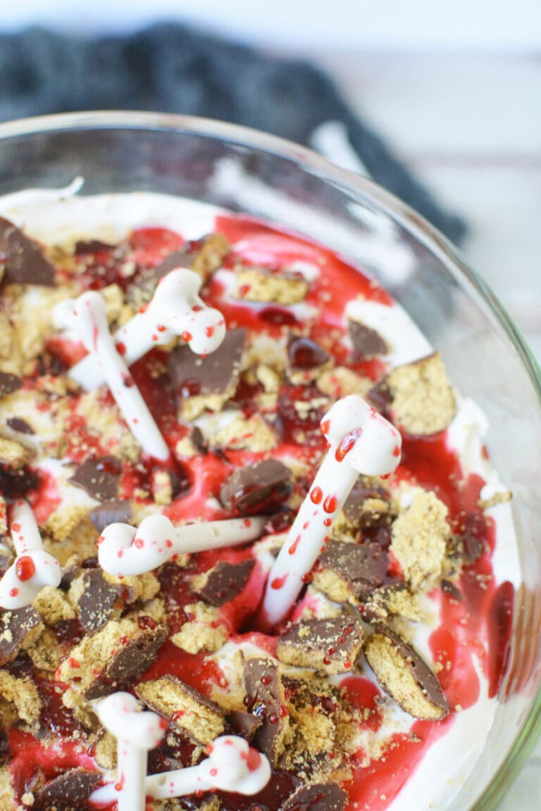 Top of a vampire trifle with chocolate cookies and bones.