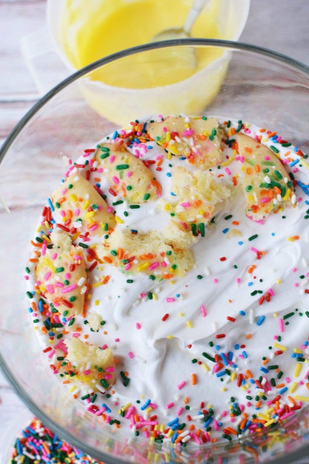 Cake and sprinkles in a layer of a trifle. 