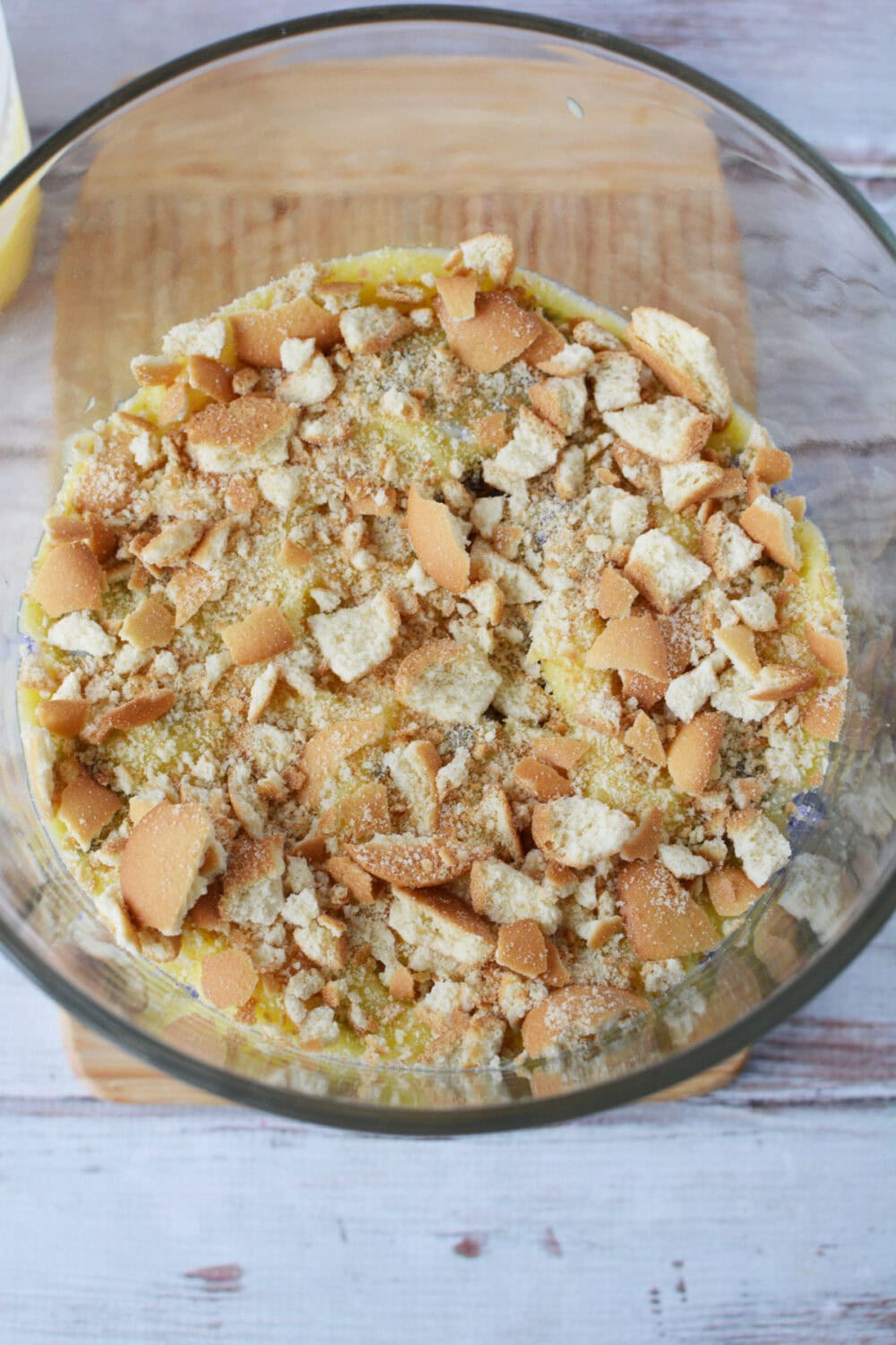 Crushed nilla wafers in a trifle bowl. 