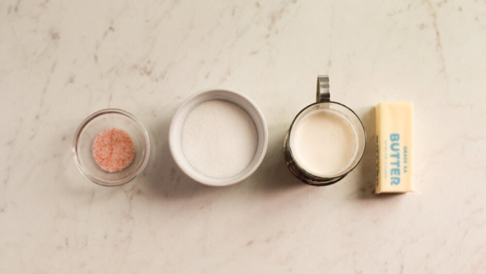 Sugar, cream, and butter in bowls. 