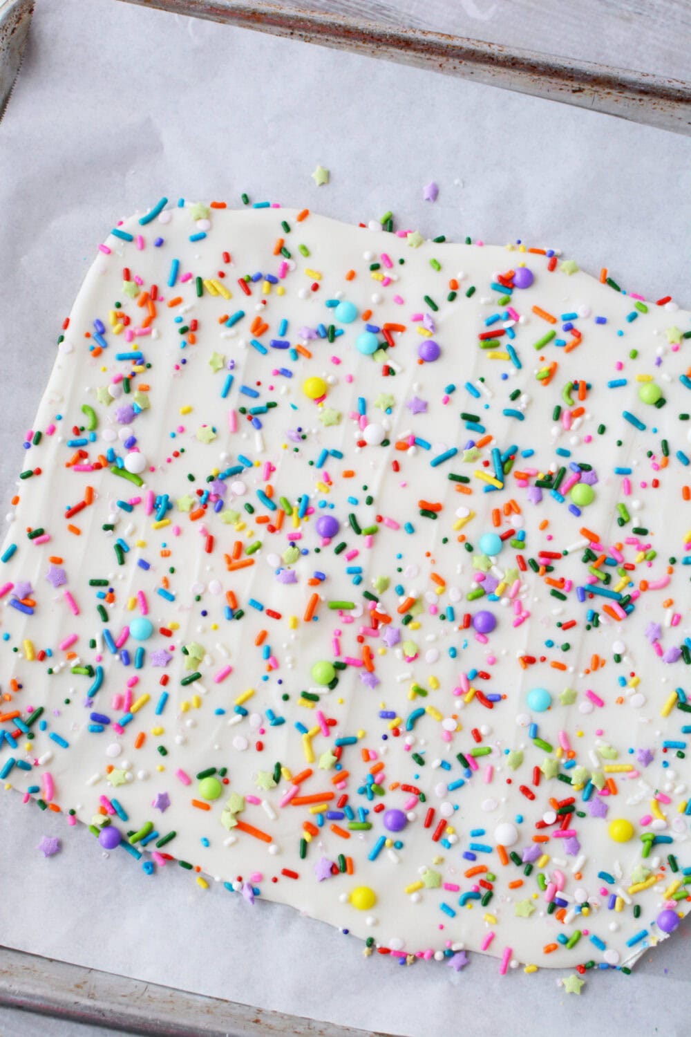 Funfetti bark candy on a baking sheet.