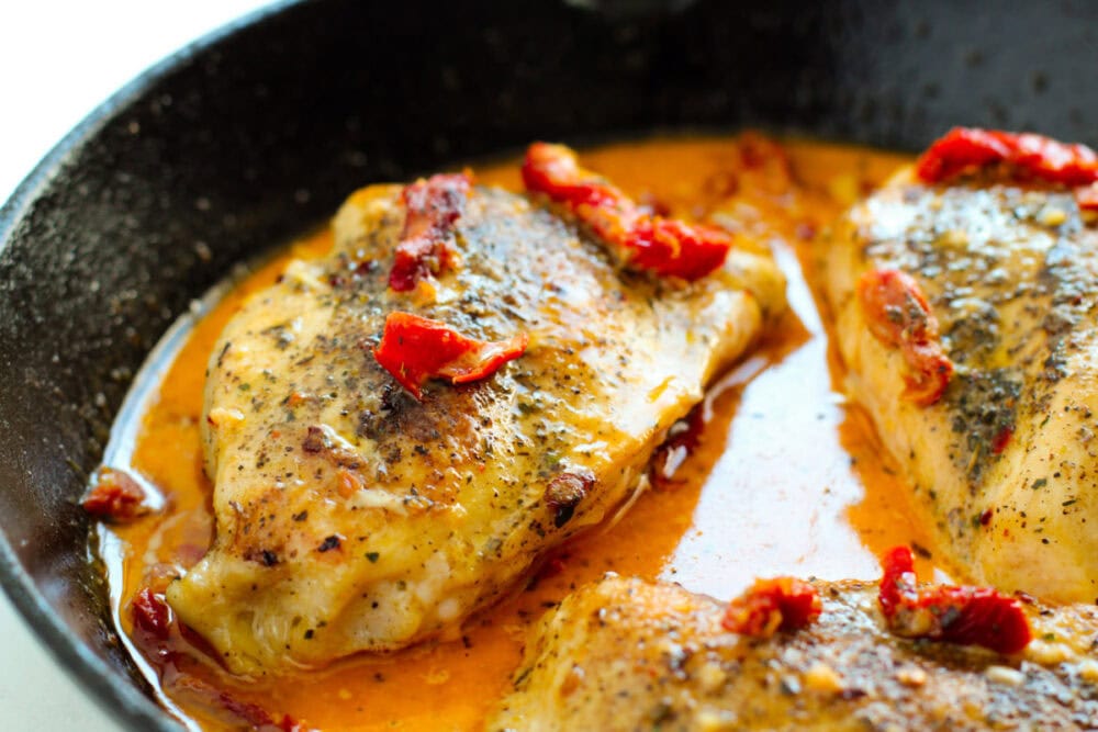 Marry me chicken in a skillet with sauce.
