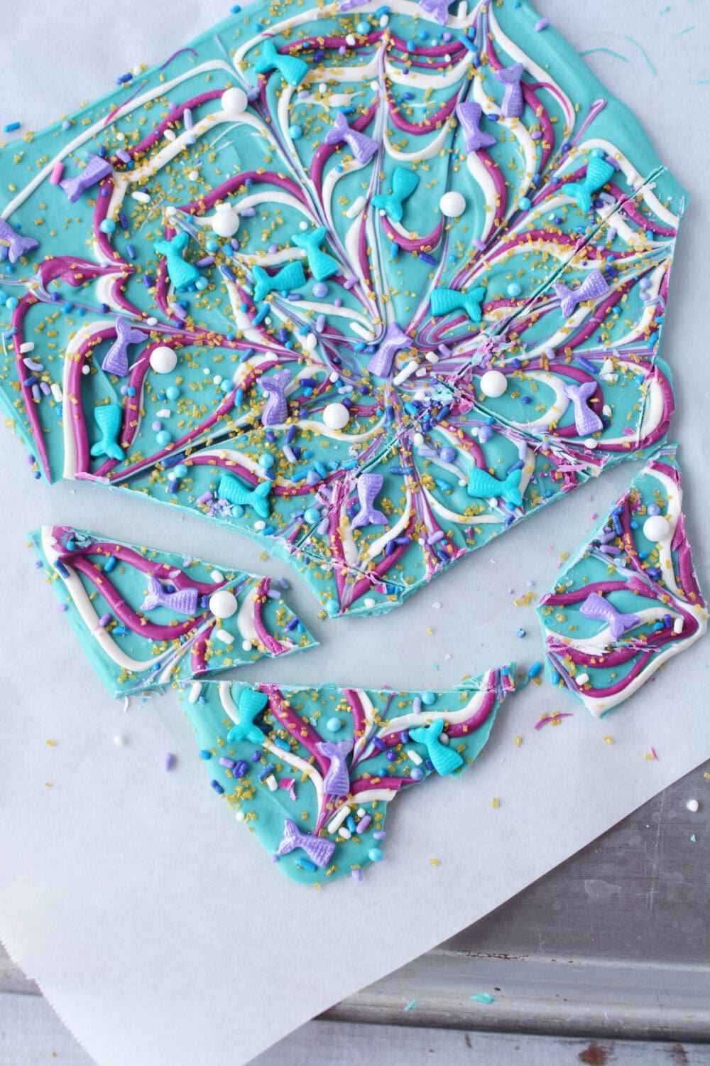 Breaking off pieces of mermaid bark candy. 