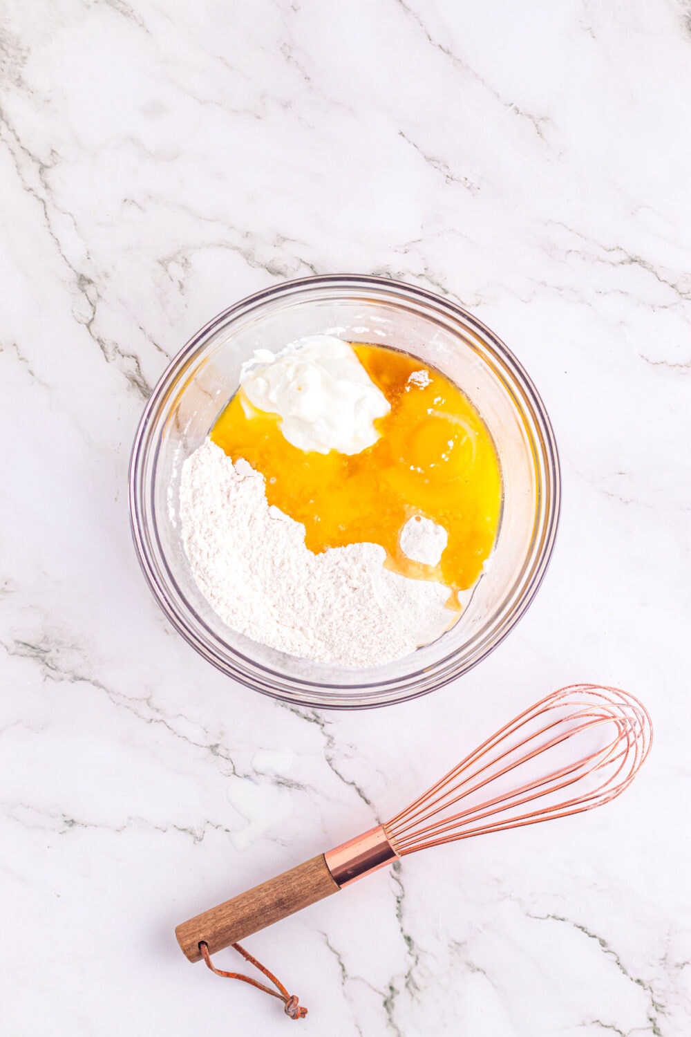 Eggs and batter in a mixing bowl. 