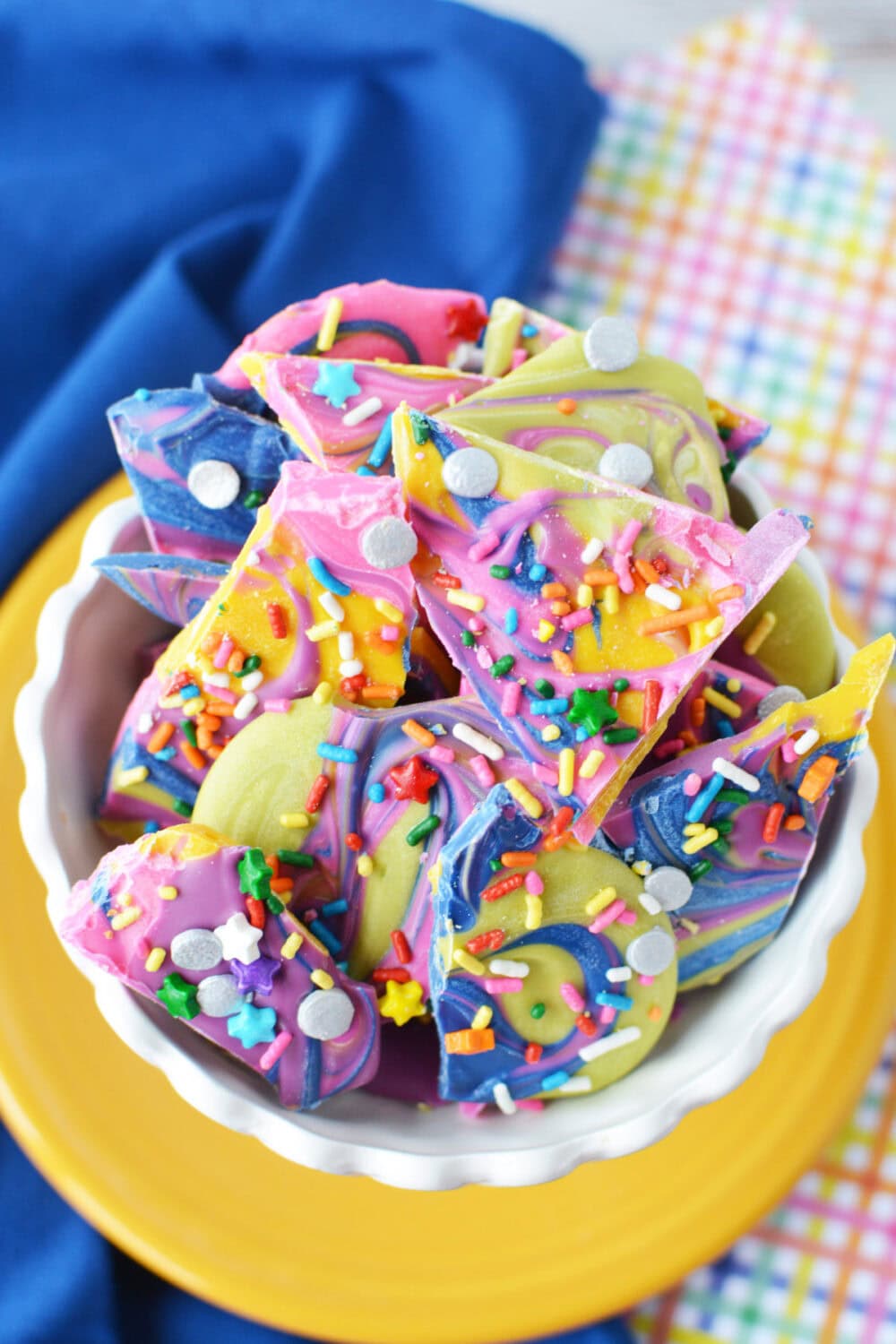 Bowl of rainbow bark candy. 