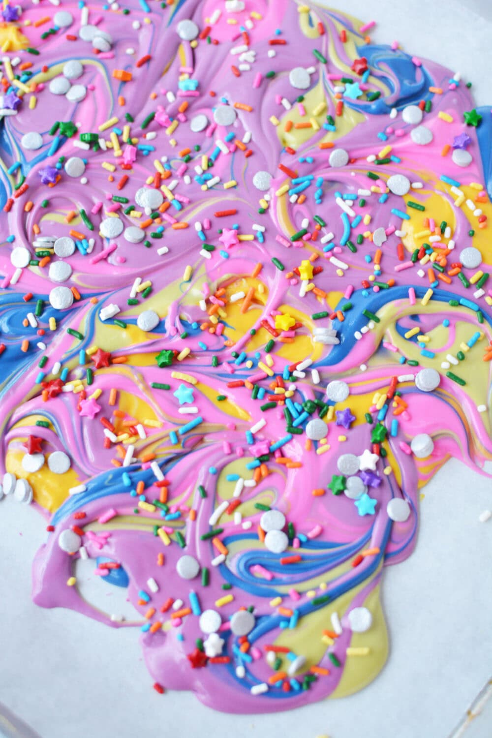 Rainbow bark on a baking sheet before breaking it up. 