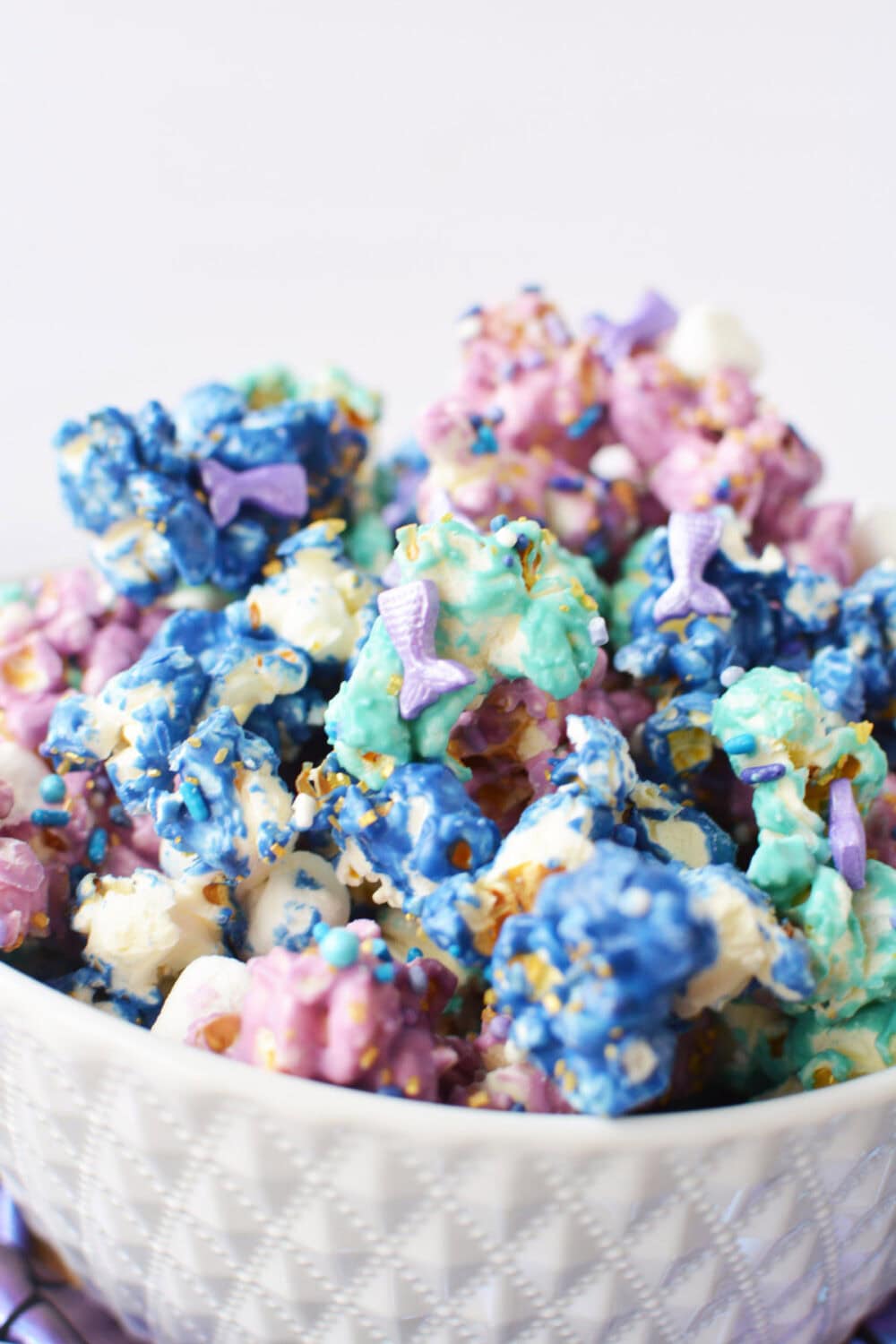 Blue, green, and purple popcorn with mermaid sprinkles and marshmallows. 