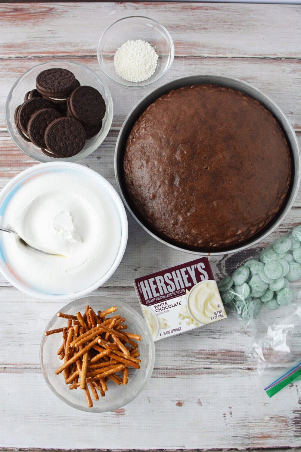 Cake, whipped cream, pretzels, cookies, and pudding. 
