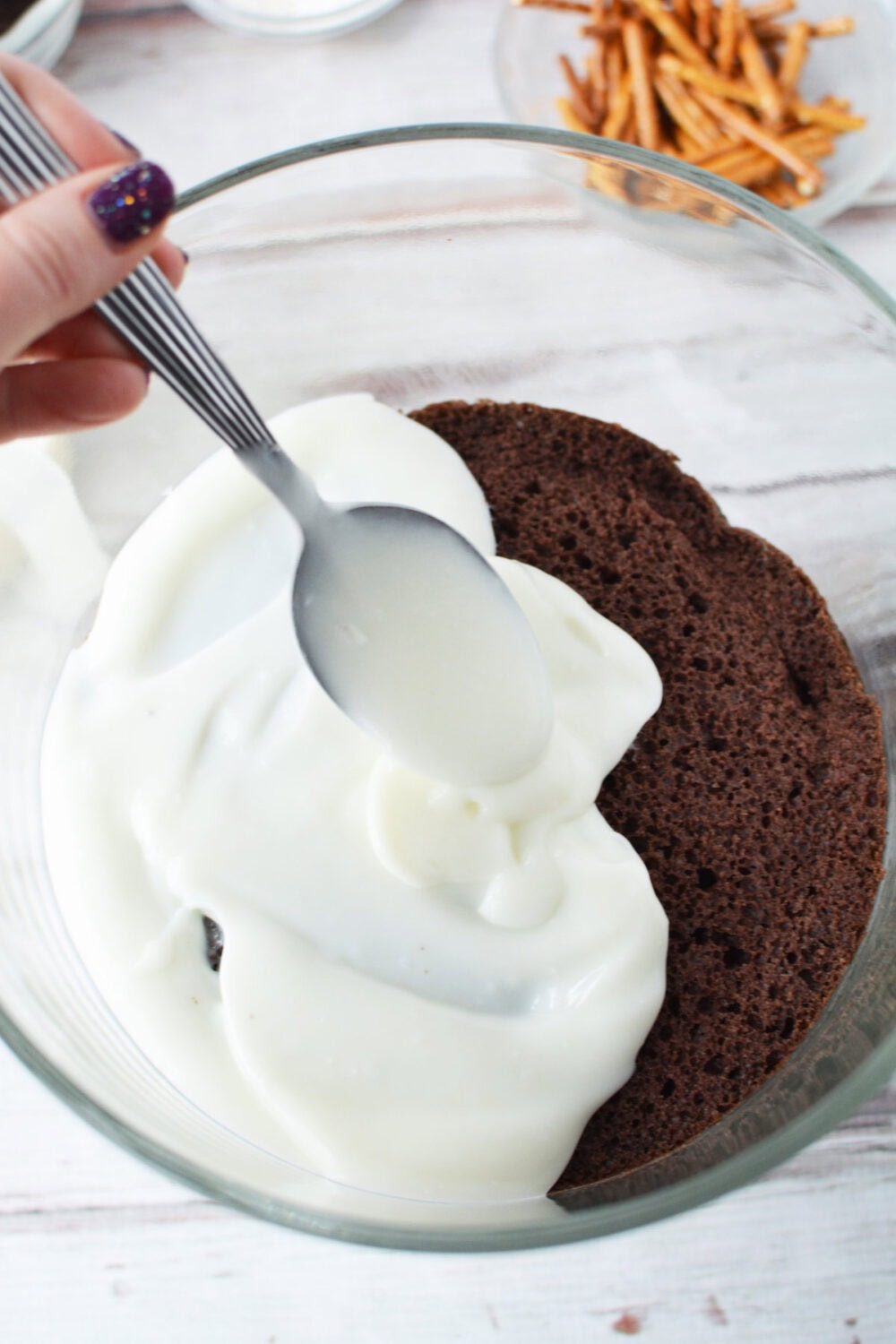 White chocolate pudding on top of cake in a trifle. 