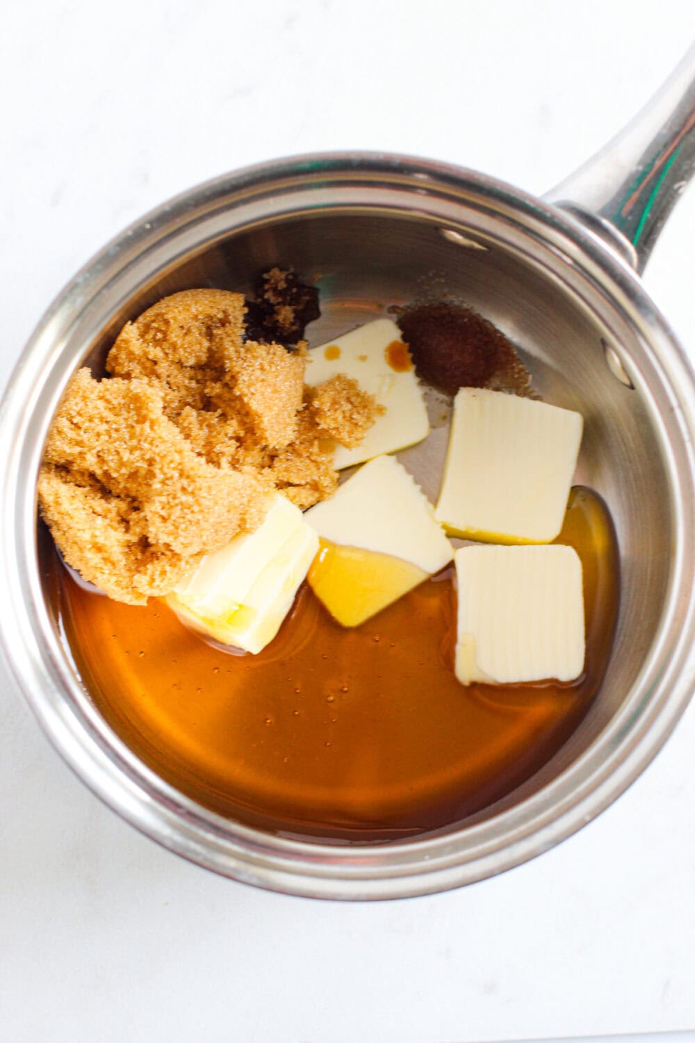 Butter, honey, and brown sugar in a pan.