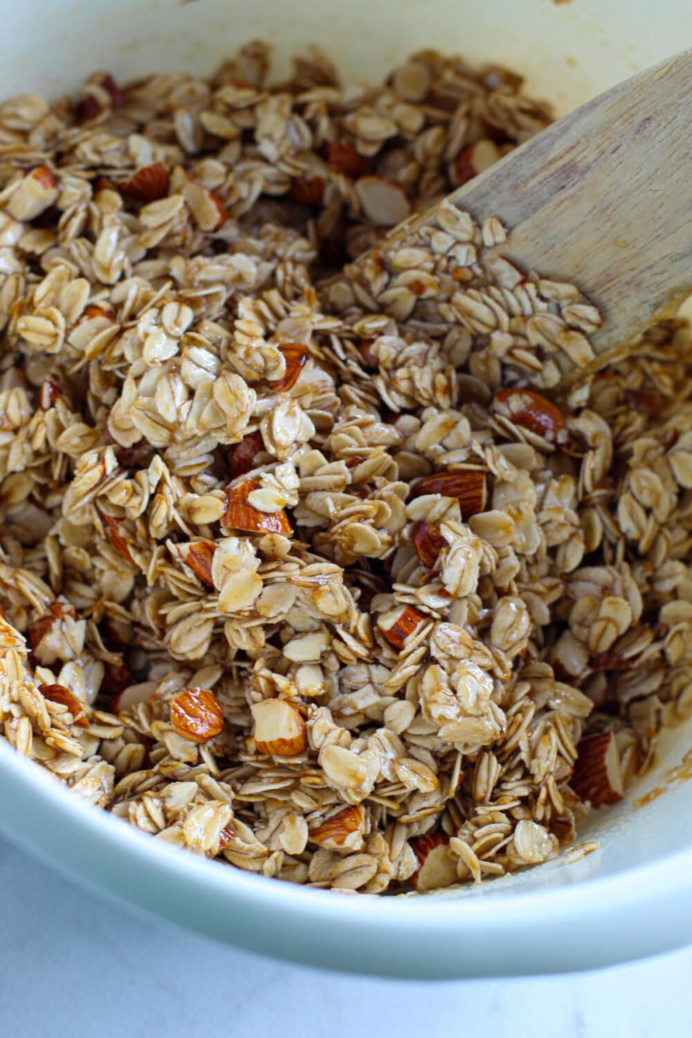 Mixing granola mixture. 