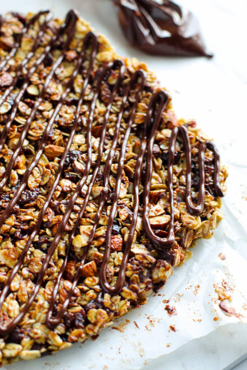 Chocolate drizzle over granola. 