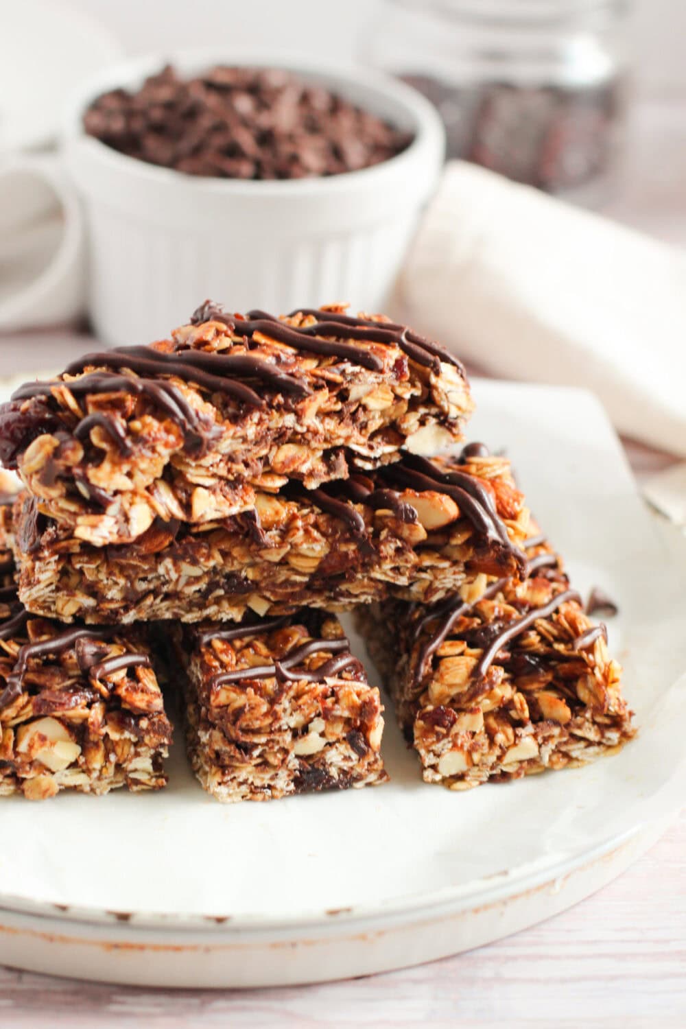 Stacked granola bars with chocolate drizzle. 