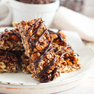 Cherry chocolate granola bars on a plate.