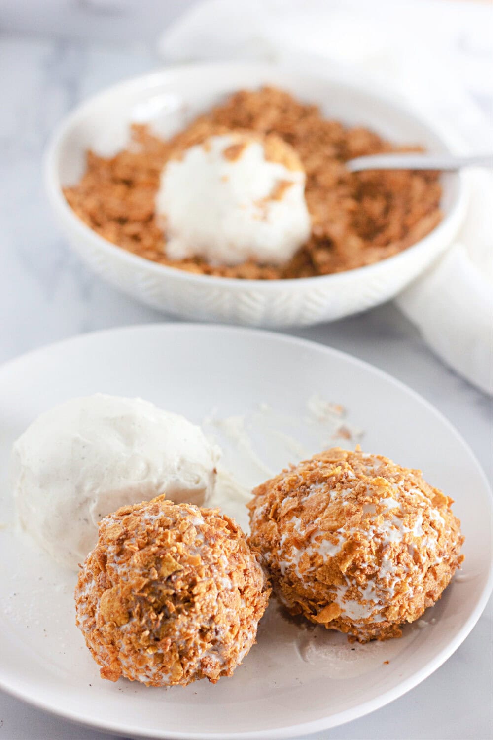 Ice cream balls coated with corn flakes.