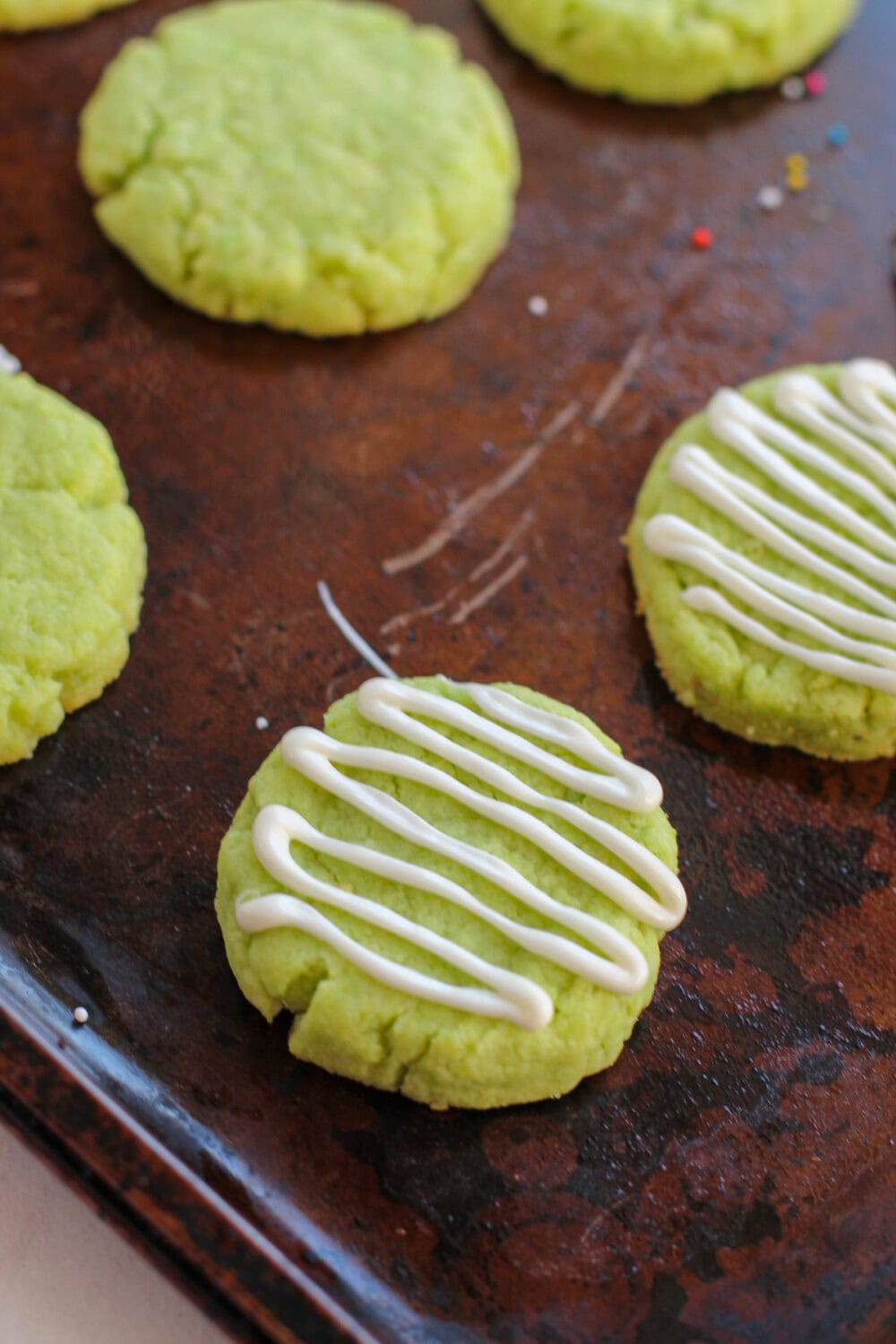 White chocolate drizzle over lime cake mix cookies.