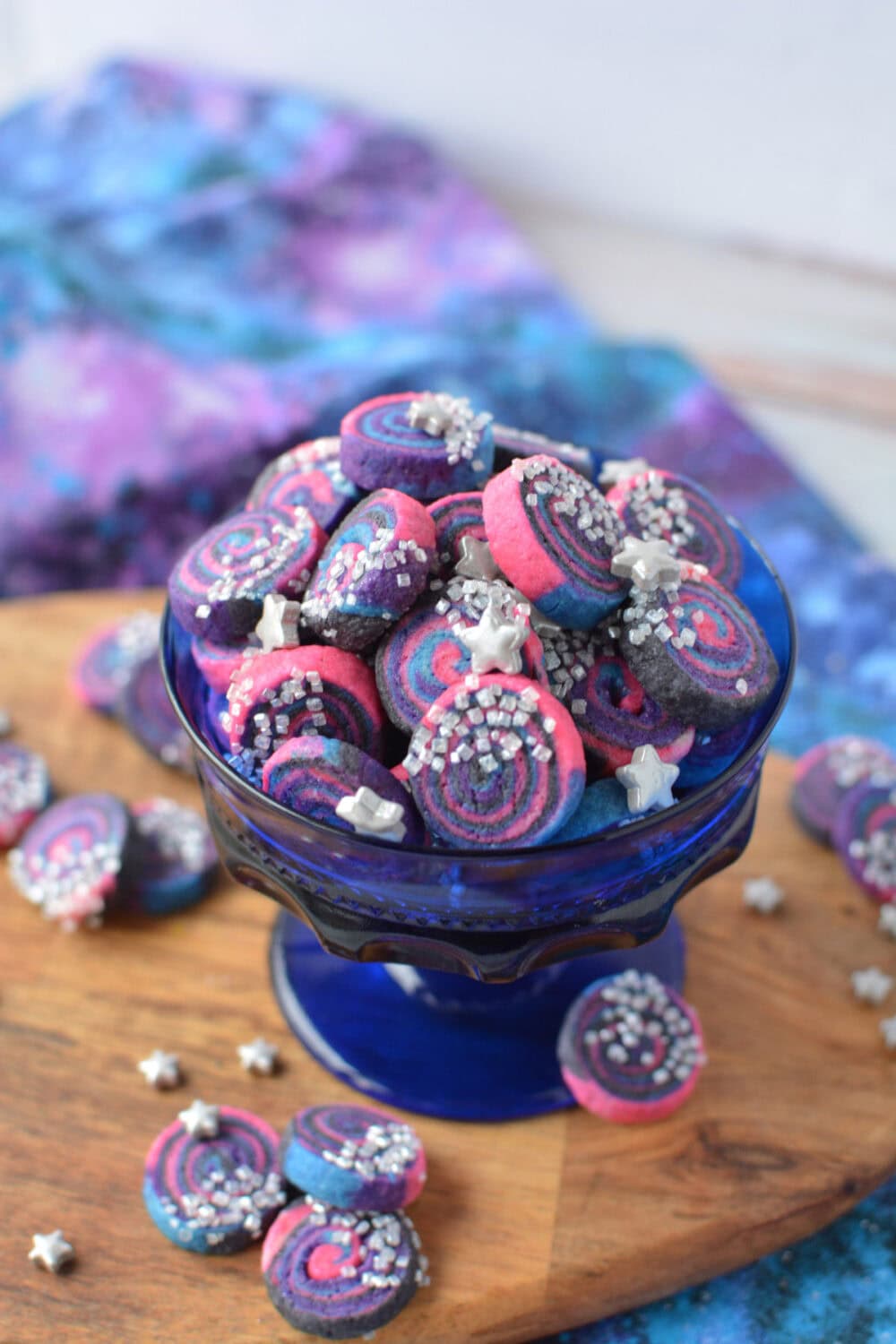 Bowl full of mini space cookies. 