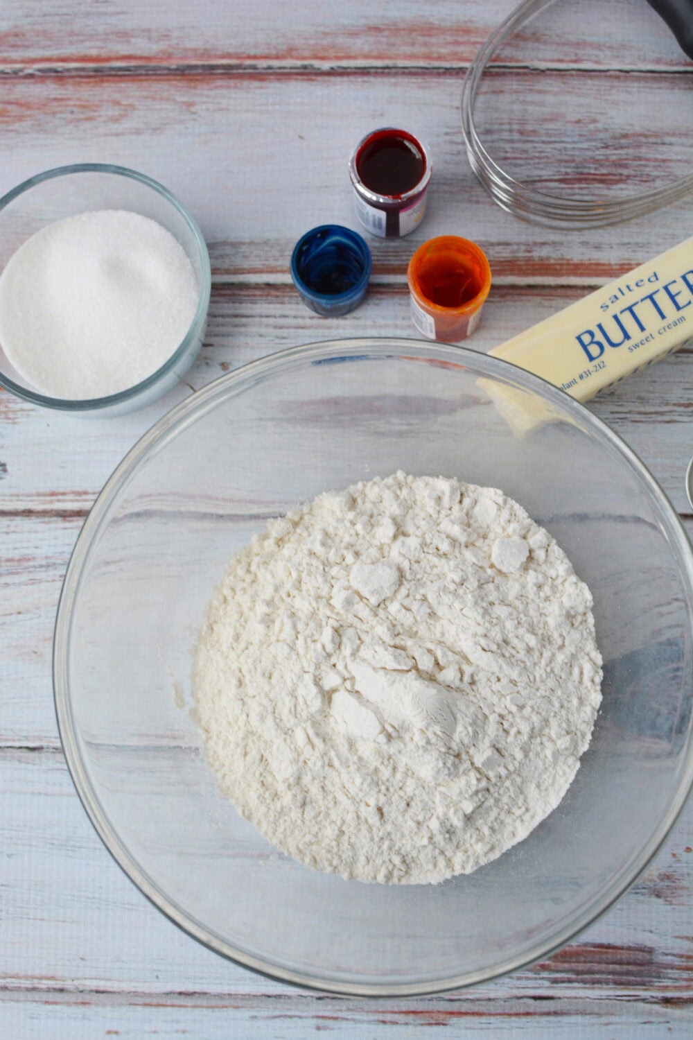 Flour, sugar, butter, and food coloring. 
