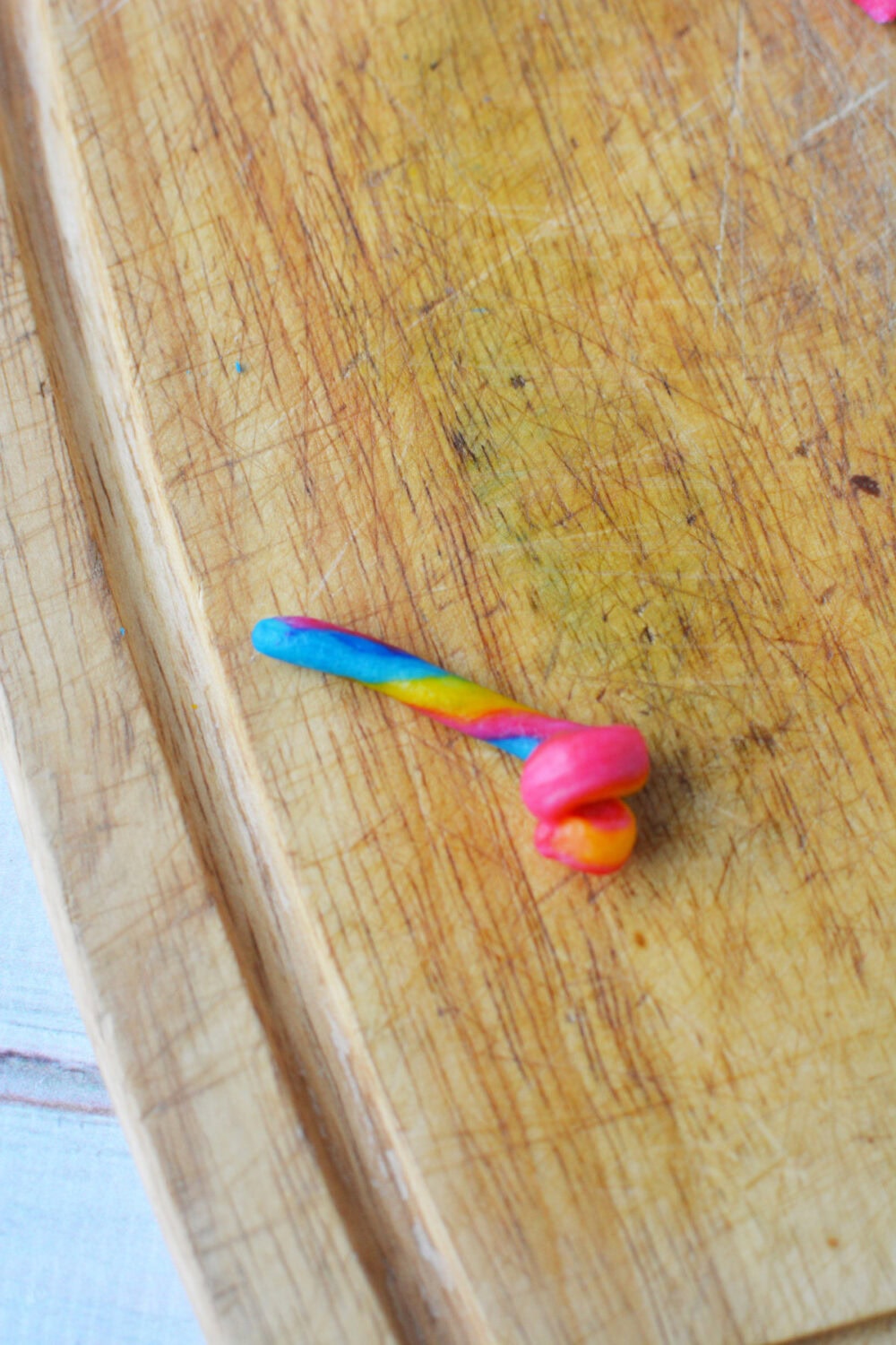 Rolling rainbow dough. 